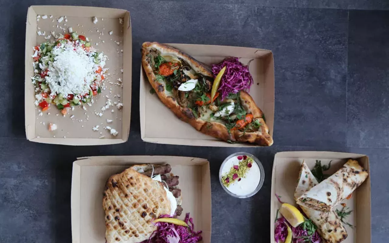 clockwise from top left, sopska salad, pide, lahmacun, a rice pudding and cevapi at balkan treat box
